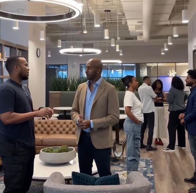 HIRE members networking at a community event